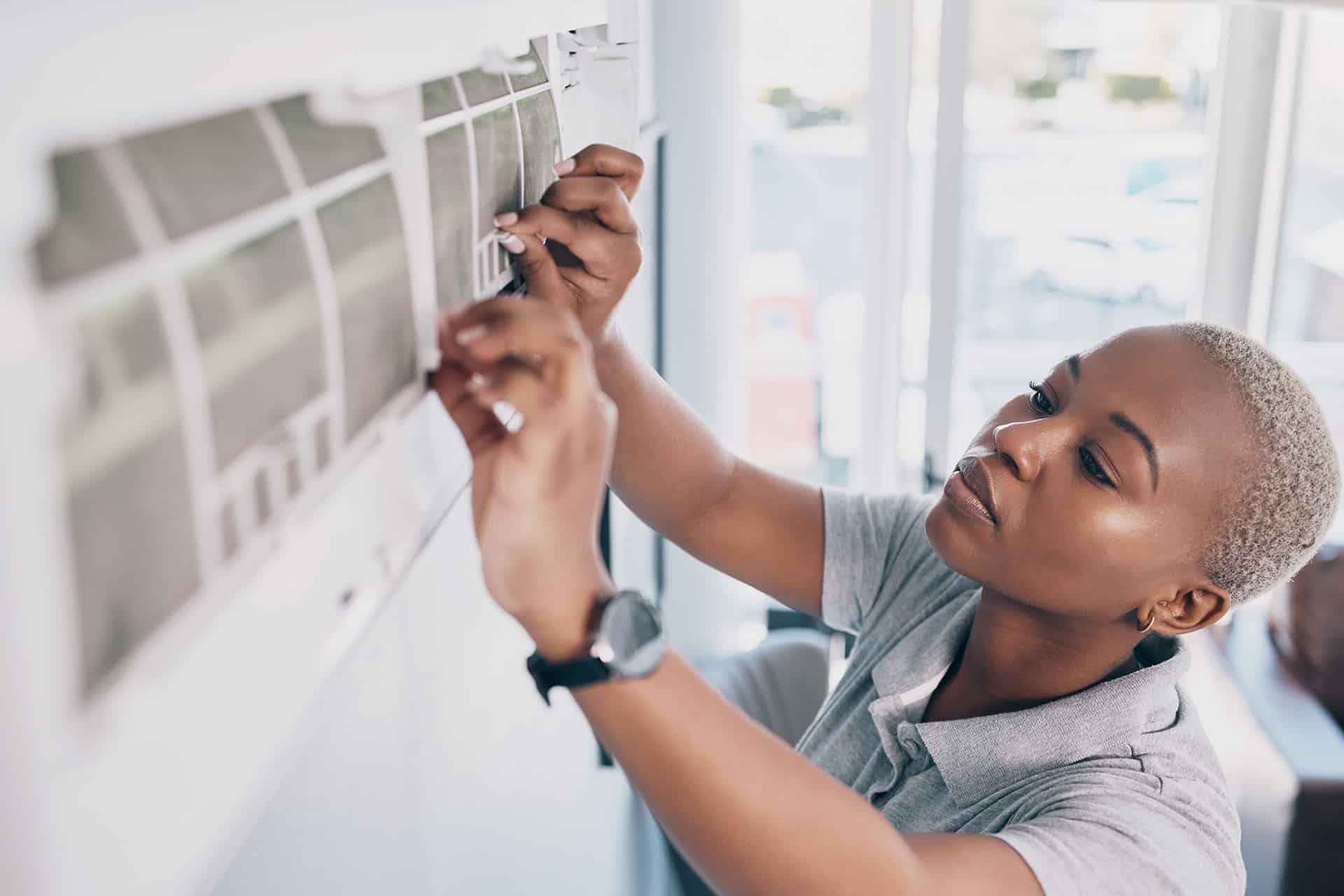 Black Woman, Electrician And Ac Repair For Electrical System, Fan Maintenance And Labor. Female Mechanic, Technician And Engineering To Fix Aircon Power, Hvac Services And Air Conditioning Machine hvac repair woman working on machine